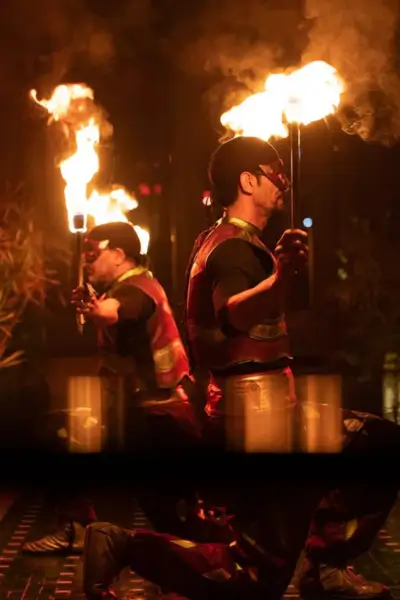 Fire torch entertainer during the nighttime show at Palais Jad Mahal, Marrakech