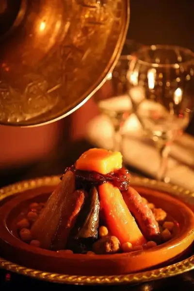 Traditional Moroccan couscous tagine with vegetables and chickpeas at Palais Jad Mahal, Marrakech